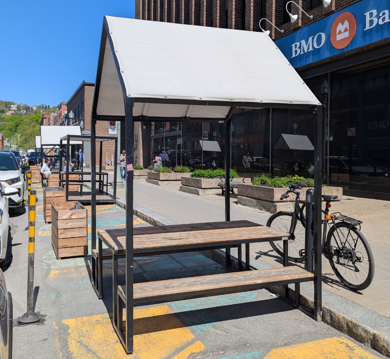 A paklet installed street-side on Greene Avenue