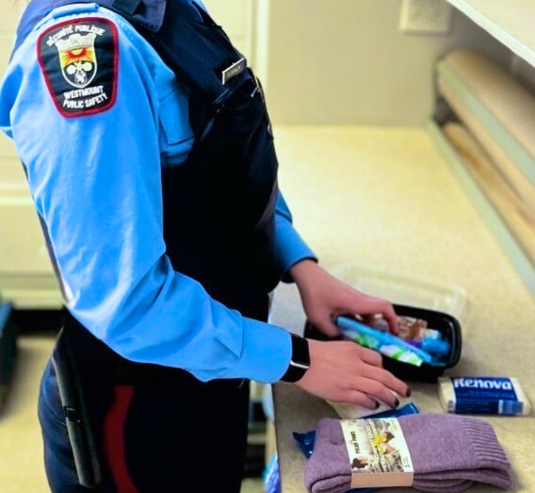 A Public Safety Officer prepares a support kit