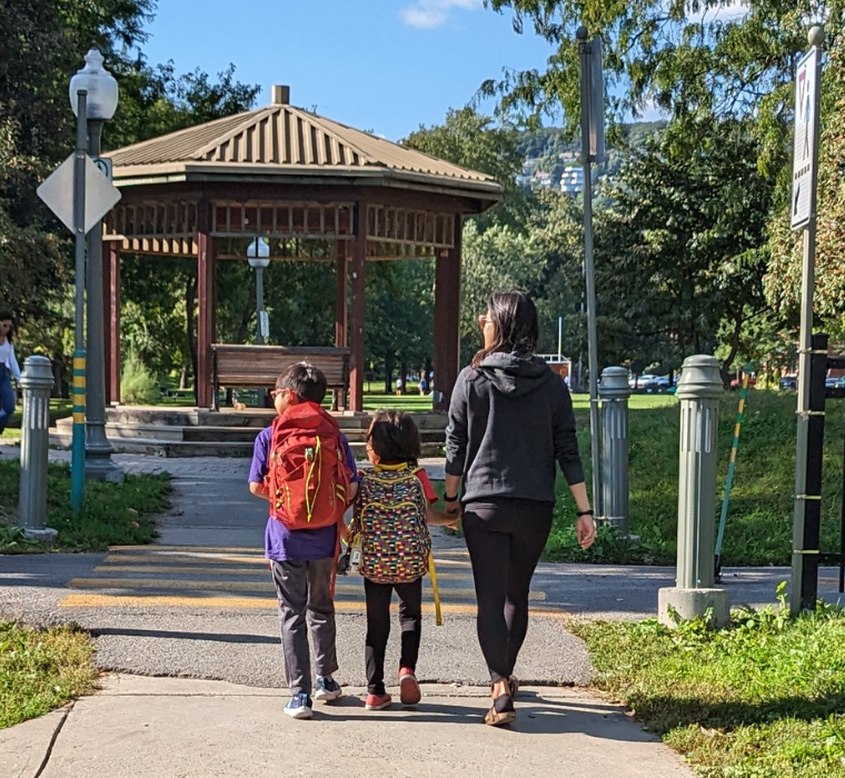 Three pedestrians at a crosswalk