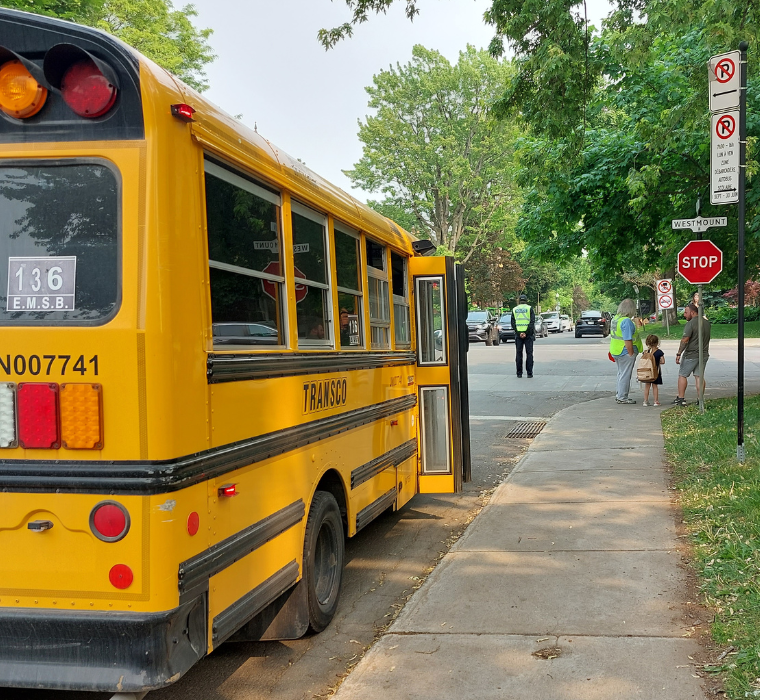 A school bus stopped in a drop-off zone