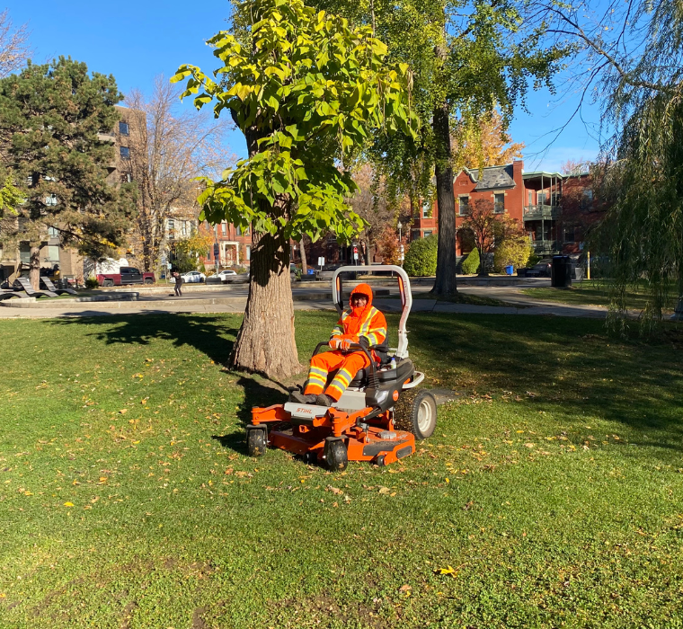 An employee is driving the new electric mower