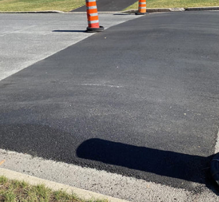 a new patch of asphalt on the road