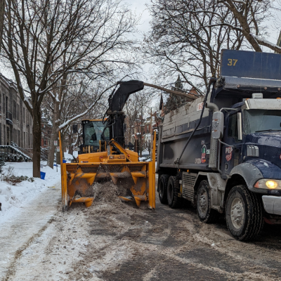 A snow loading operation underway