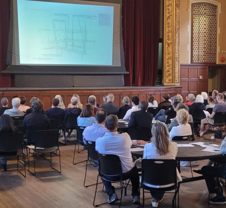 People sitting in front of a presentation