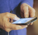 A smartphone in an older persons hands